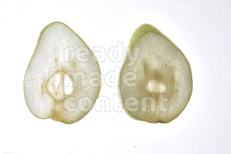 Pear slices on illuminated white background