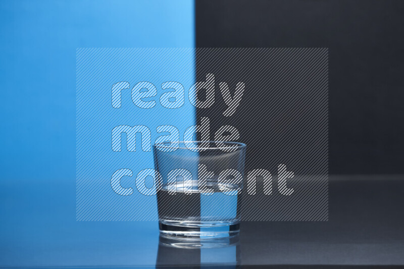 The image features a clear glassware filled with water, set against blue and black background