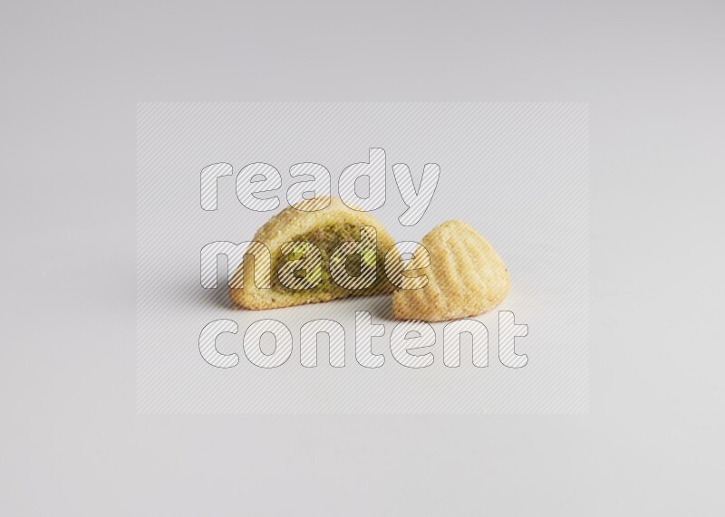 Half Maamoul filled with pistachio direct on white background