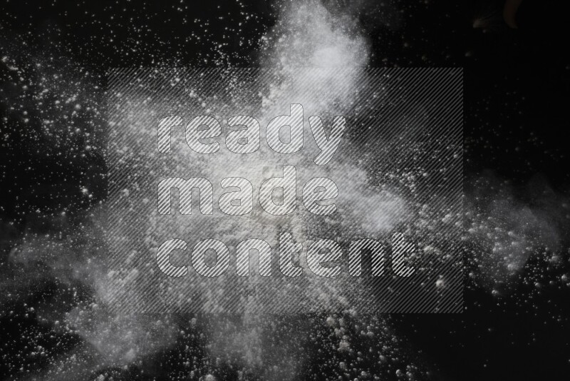 White powder explosion on black background