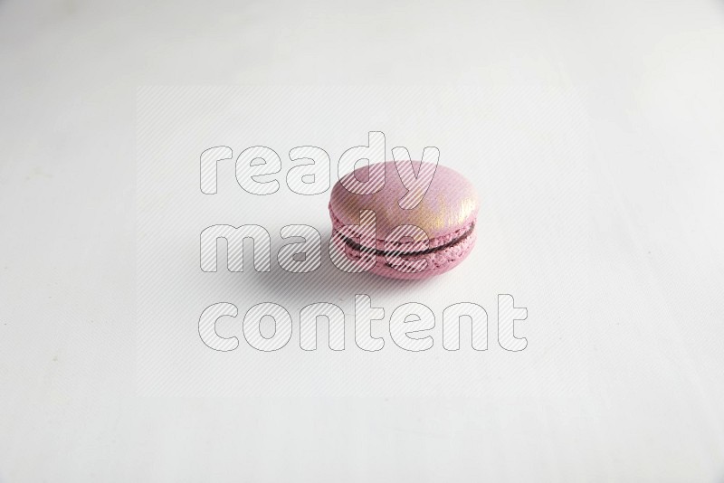 45º Shot of Purple Strawberry macaron on white background