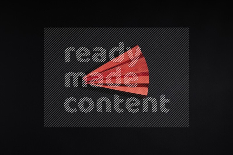 Red paper sheet on black background