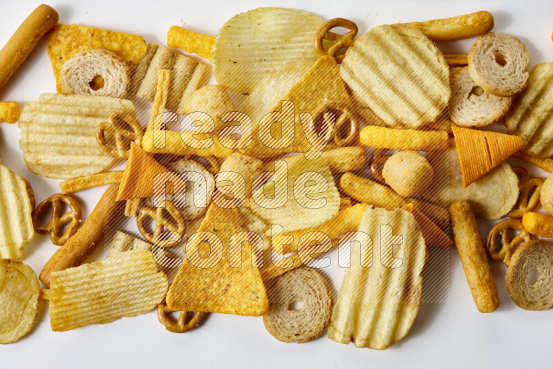 Assorted snacks on white background