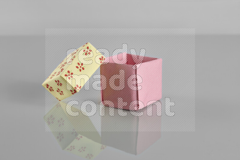 Origami gift box on grey background