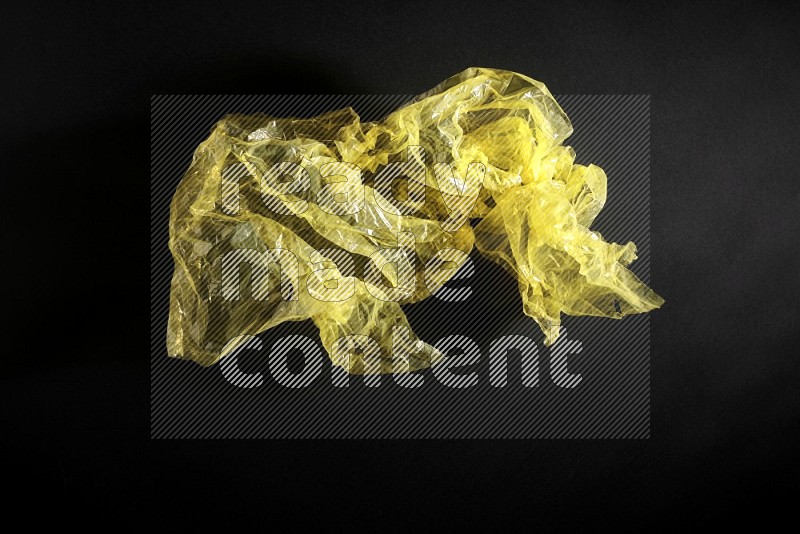 Colored plastic textures on black background