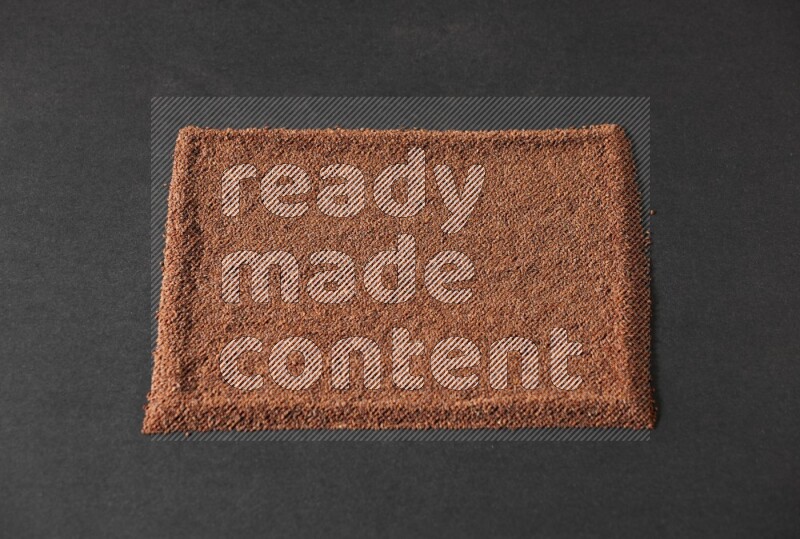 Garden cress seeds filling the frame on a black flooring