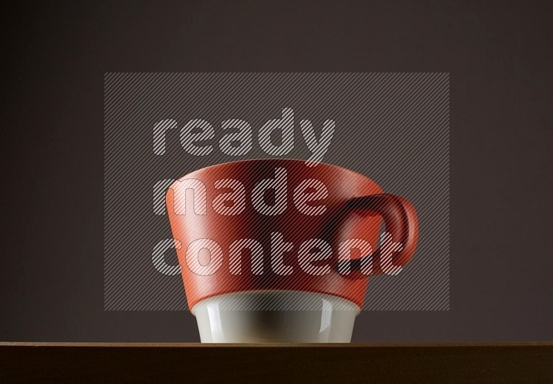 Low angle shot of a bicolor cup on grey background
