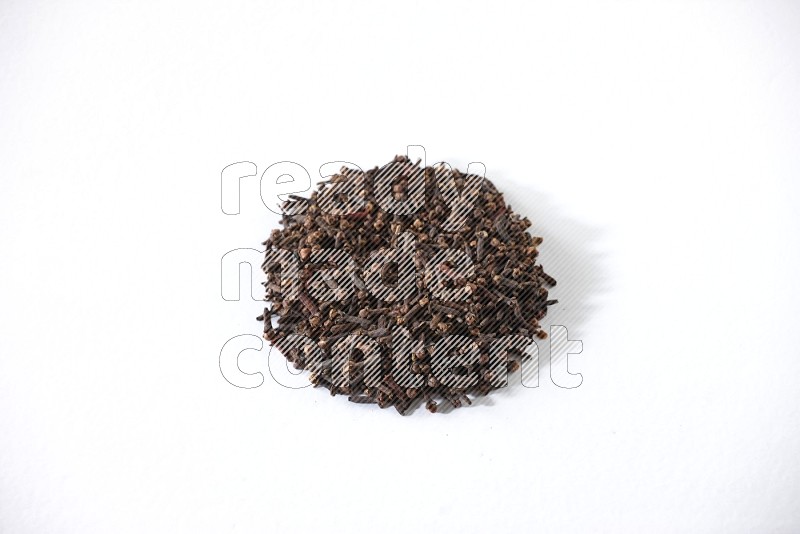Cloves in a circle shape on a white flooring