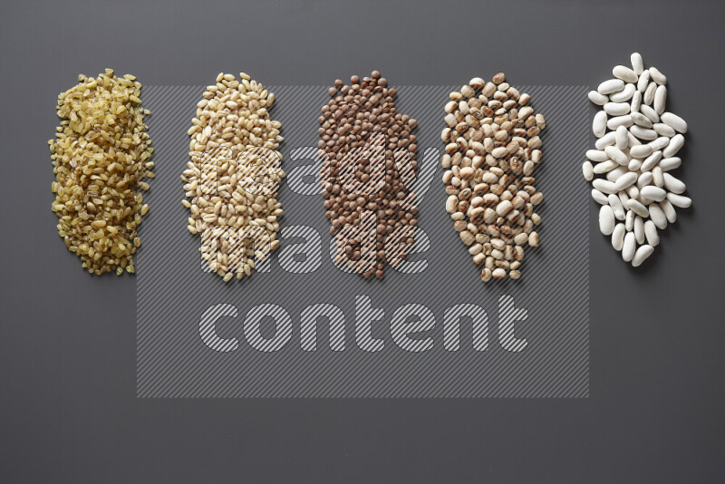 Bunches of legumes on grey background