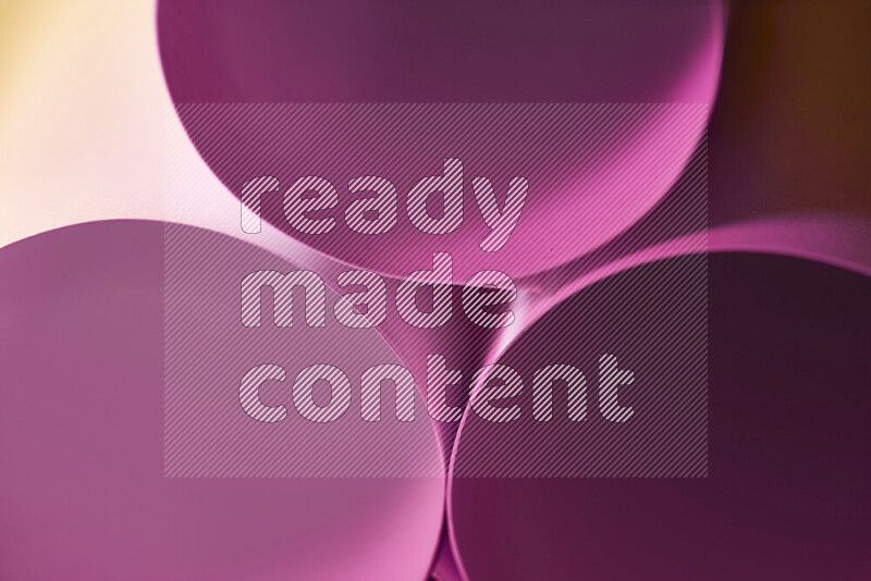 The image shows an abstract paper art with circular shapes in varying shades of pink and warm tones