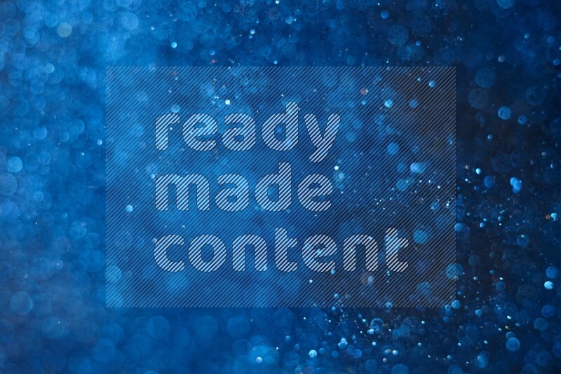 Blue glitter powder isolated on black background