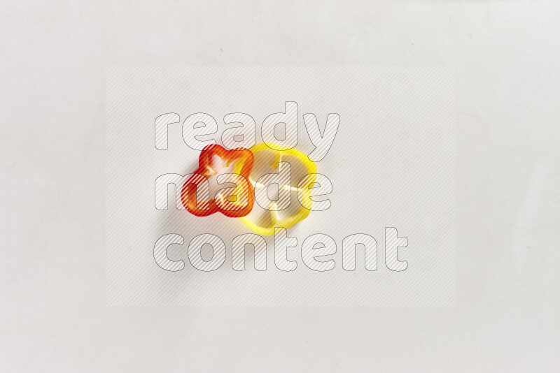 Assorted bell pepper slices on white background