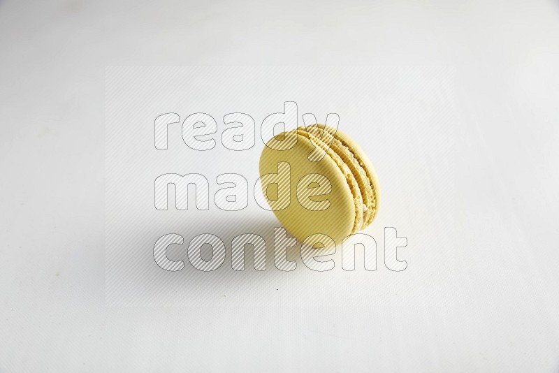 45º Shot of Yellow Lime macaron on white background