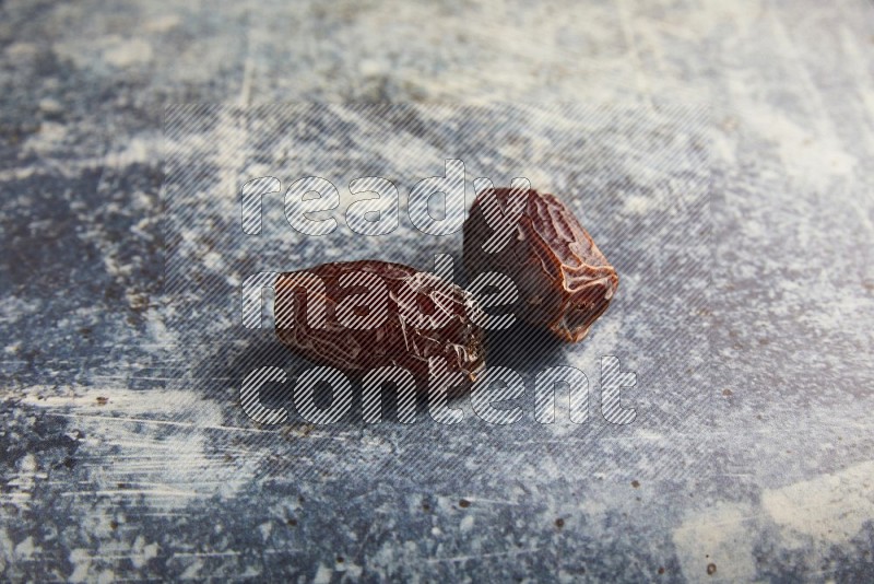 two madjoul dates on a rustic blue backround