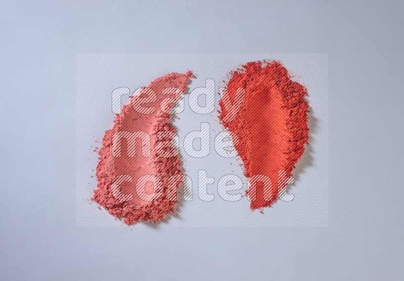 Red powder strokes on white background