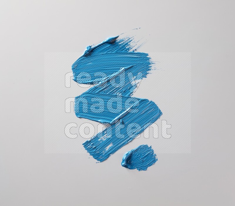 Multi blue straight brush strokes in different shapes on a white background