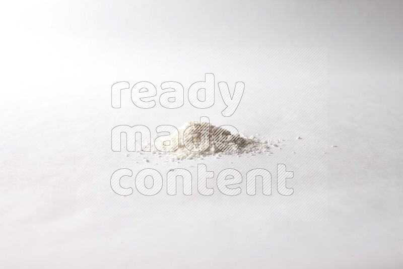 Desiccated coconuts on white background