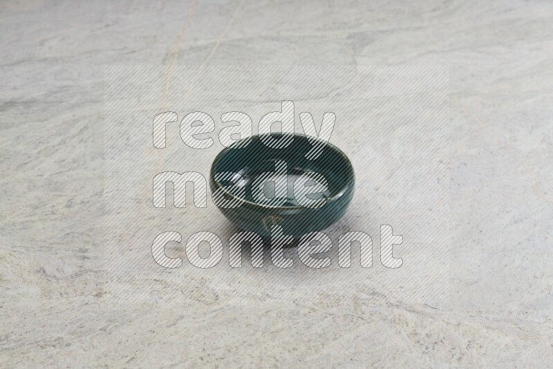 Dark Green Pottery Bowl On Grey Marble Flooring