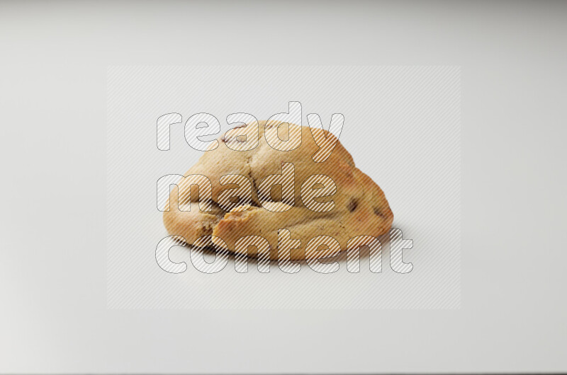 a chocolate chip cookie on a white background