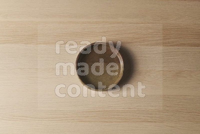 Top View Shot Of A Multicolored Pottery Oven Plate on Oak Wooden Flooring