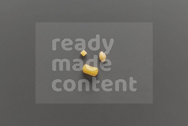 Different pasta types on grey background