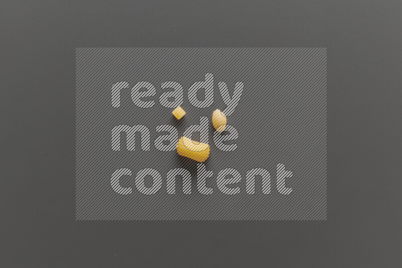 Different pasta types on grey background
