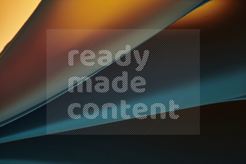 An abstract art piece displaying smooth curves in warm and cold gradients created by colored light