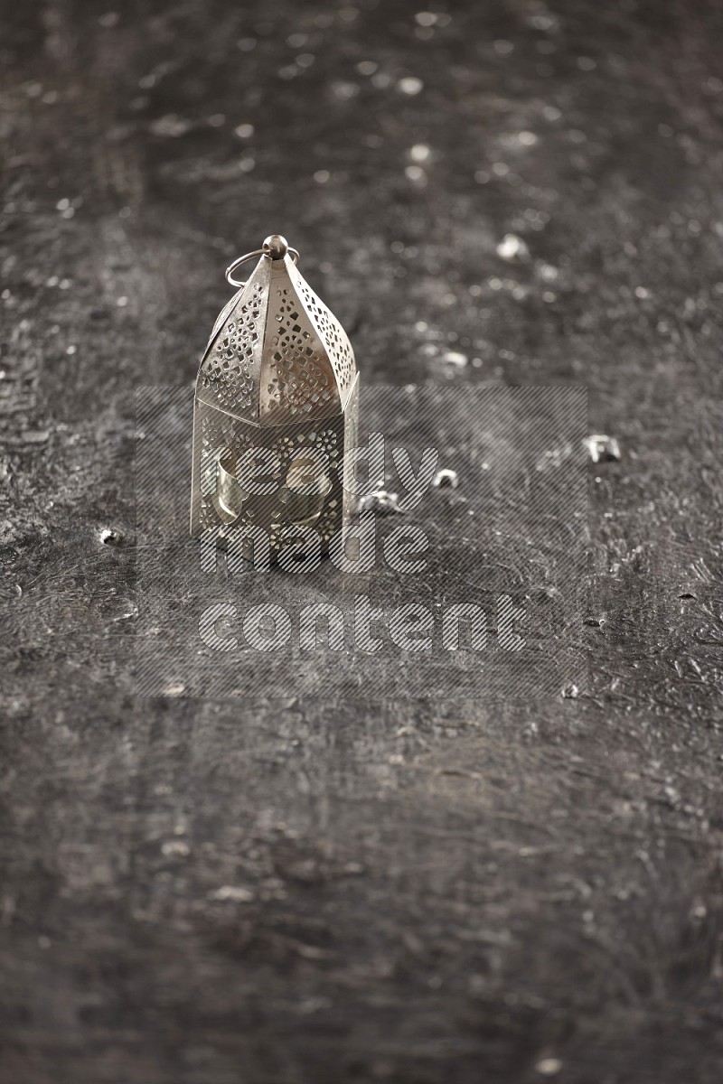 A lantern on textured black background