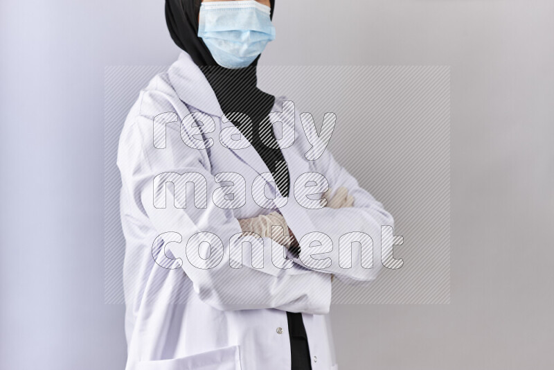 Female doctor wearing an abaya and medical attire in different positions