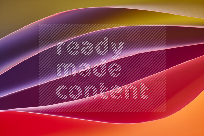This image showcases an abstract paper art composition with paper curves in different warm gradients created by colored light