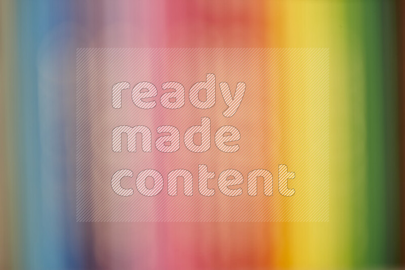 The image captures a close-up of sharpened colored pencils on multicolored background