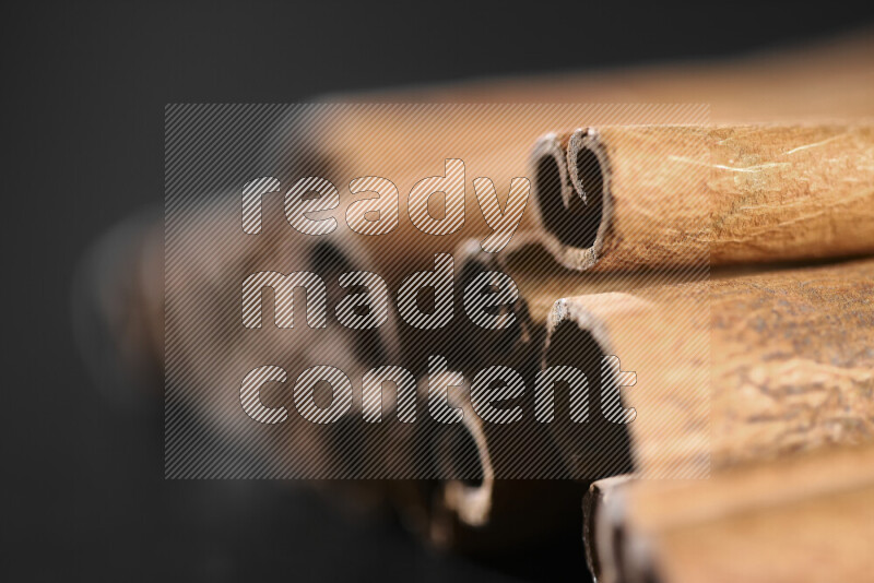 Cinnamon sticks on black background