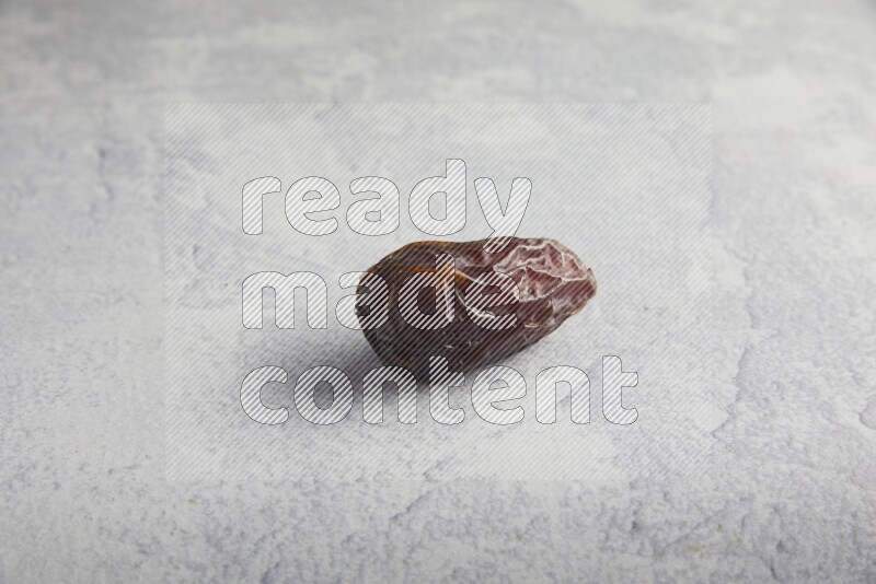 one madjoul date on a light grey background