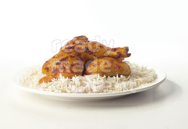 white  basmati Rice with  kabsa chicken pieces  on a white rounded plate direct on white background