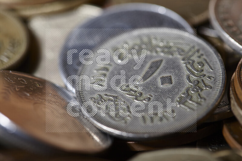 A close-ups of random old coins on black background