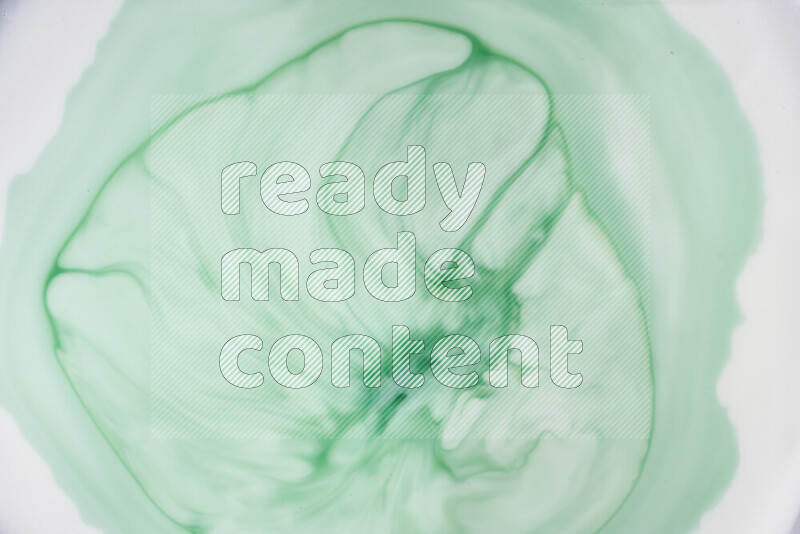 A close-up of abstract swirling patterns in green gradients