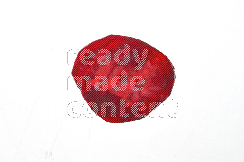 Beet slices on illuminated white background