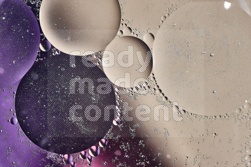 Close-ups of abstract oil bubbles on water surface in shades of brown, purple and pink
