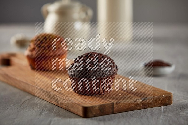 Chocolate cupcake on a wooden board