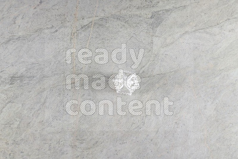 Top View Shot Of A Candle Lantern On Grey Marble Flooring