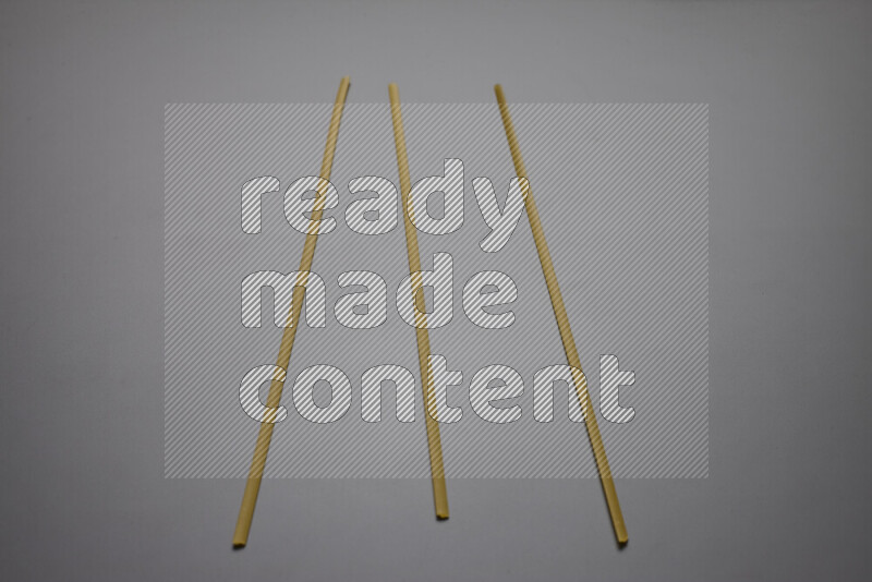 Linguini pasta on grey background