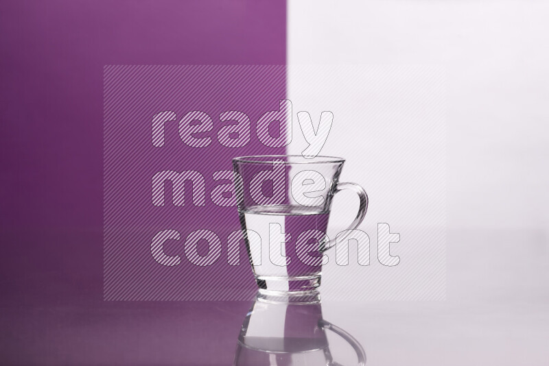 The image features a clear glassware filled with water, set against white and purple background