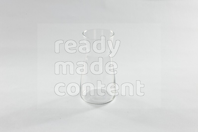 Glassware such as coffee pot, cup, saucer and jar on white background