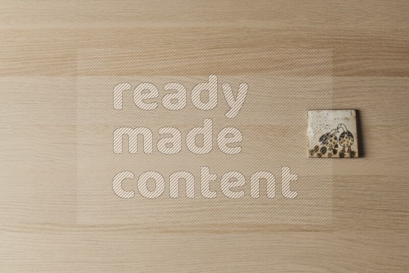 قواعد أكواب فخارية مزخرفة على خلفية خشبية فاتحة