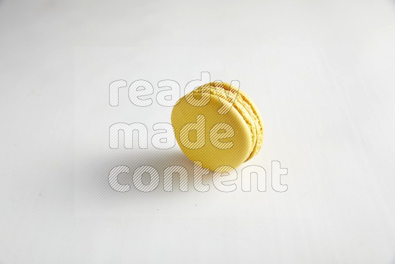 45º Shot of Yellow Lemon macaron on white background