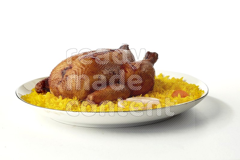 yellow  basmati Rice with kabsa chicken pieces on a white plate with a silver rim direct on white background