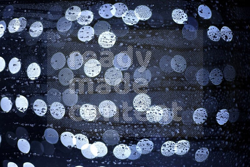 Bokeh light in white with water drops