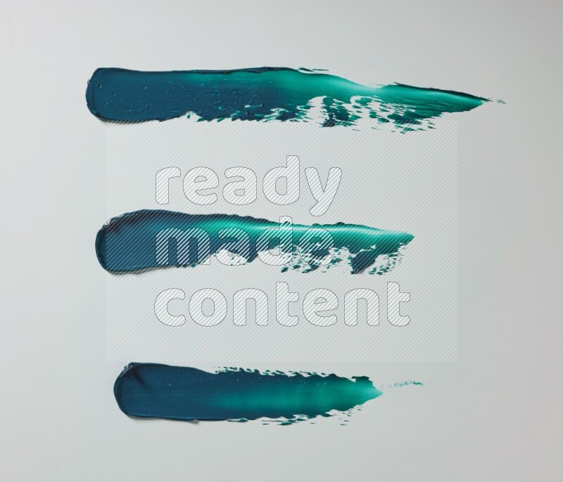 Turquoise painting knife strokes on white background