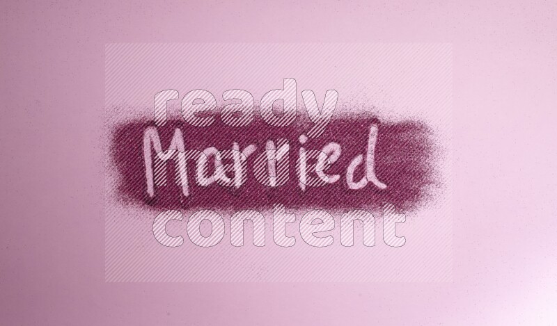 A word written with pink glitter on pink background