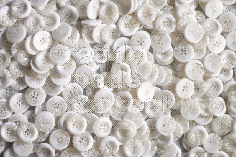 أزرار بيضاء موضوعة علي خلفية رمادية